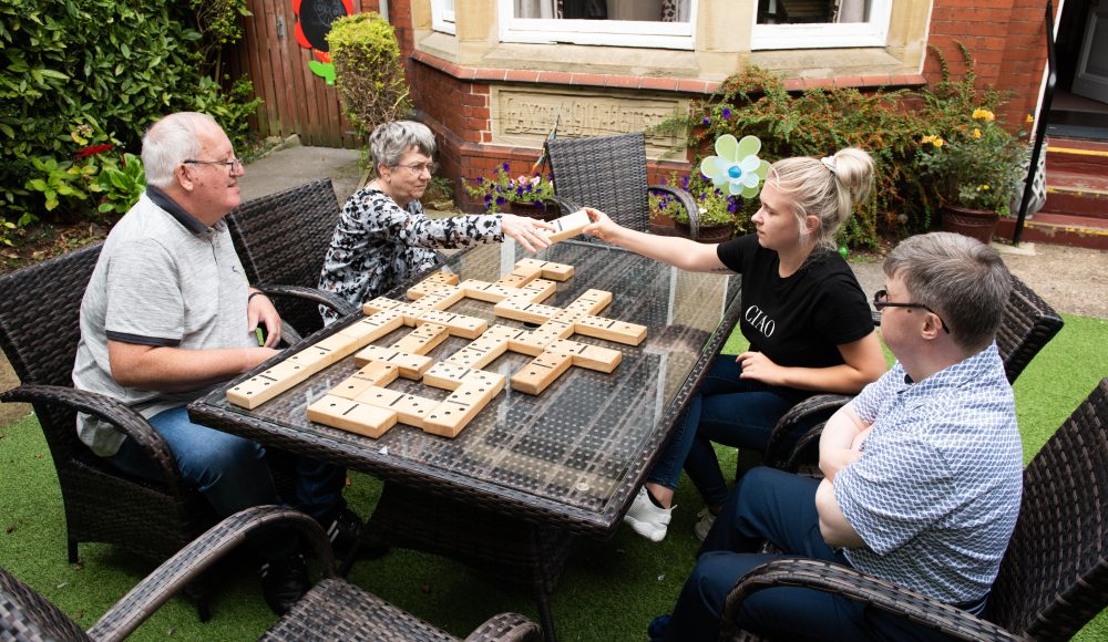 Residents playing giant dominos at Harry Priestley House