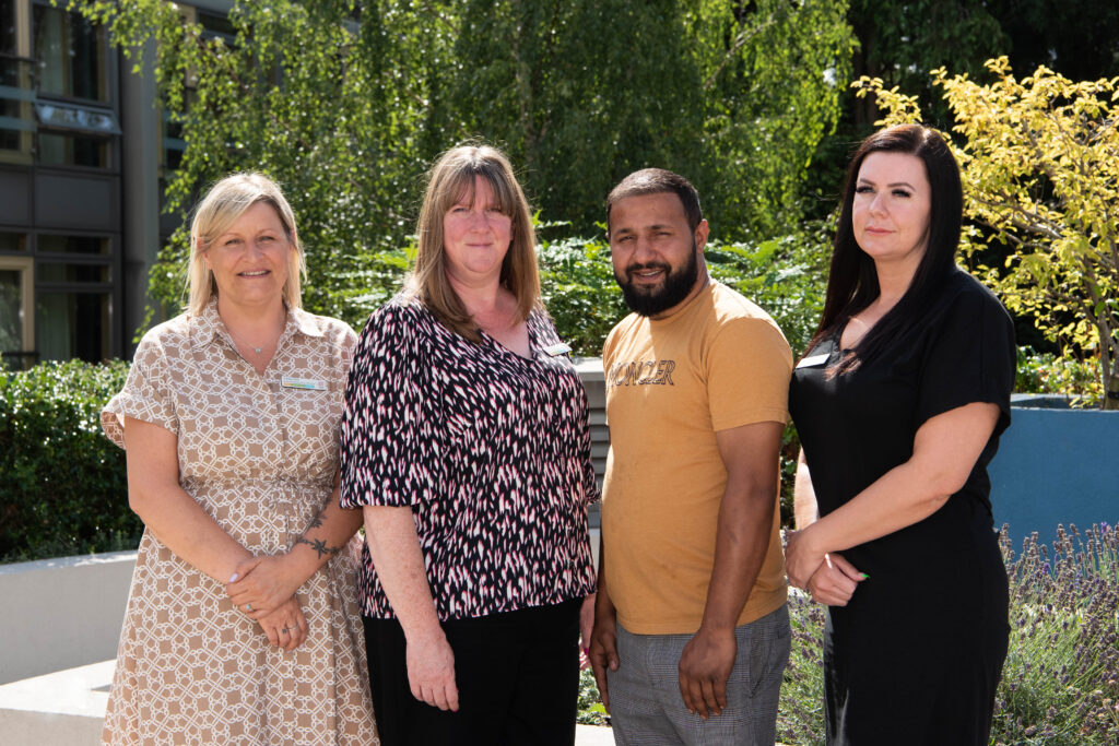 James Terry Court Home Management Team outside the care home, capturing a moment of togetherness and support.