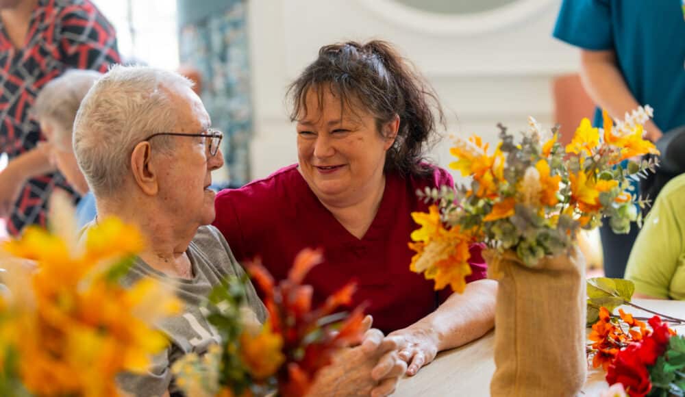 A care home resident and staff member
