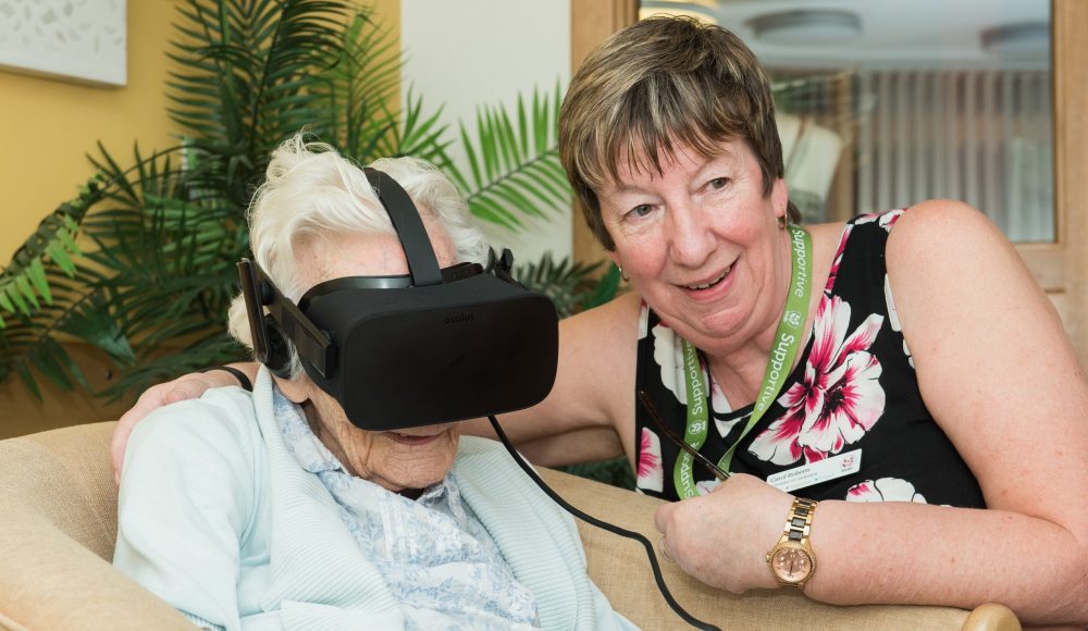 Resident and staff member using Virtual Reality at James Terry Court