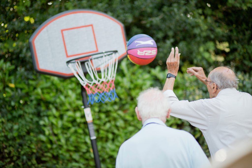 Residents playing basketball at Prince Michael of Kent Court