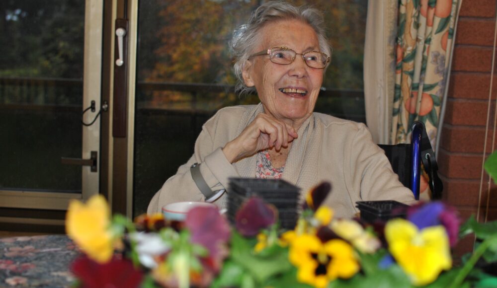 Cadogan Court resident enjoying some winter gardening at the Home in Exeter