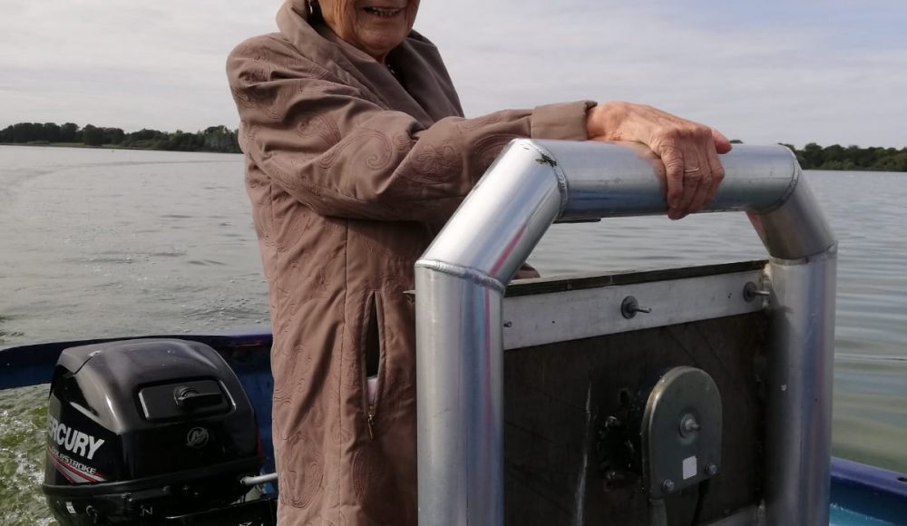 Josie steering the boat on Hornsea Mere