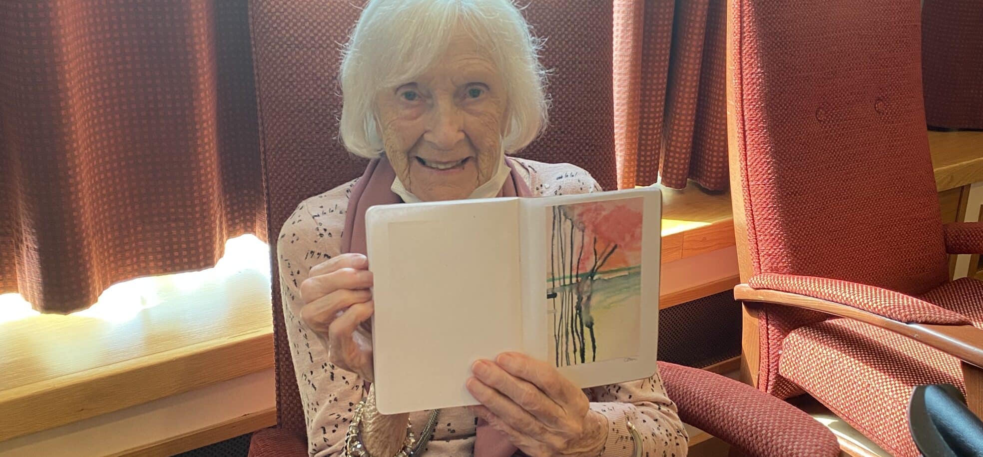Resident Gwen Woodward, aged 97 with her abstract flowers painting