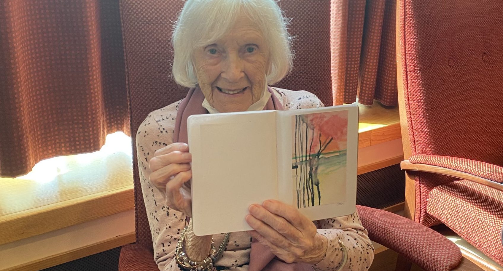 Resident Gwen Woodward, aged 97 with her abstract flowers painting