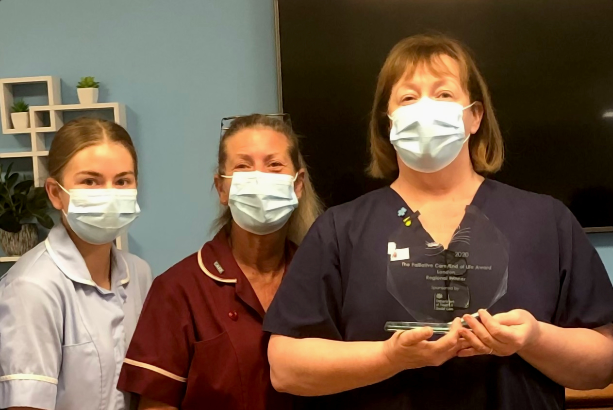 Clinical Lead Kim Fletcher holds her award while celebrating with staff members Pauleen Wickes and Amber Tarleton at Prince George Duke of Kent Court.