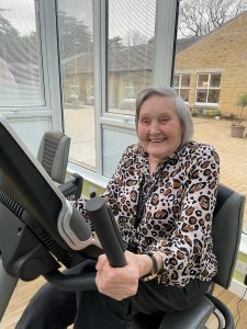 Sporty care home resident Pamela Brett during her daily cycle at RMBI Home Prince Michael of Kent Court, in Watford