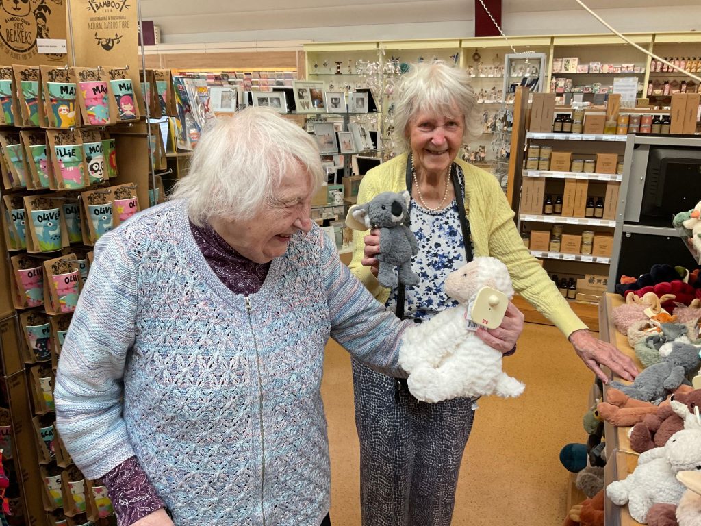 Residents Beryl and Joyce pick stuffed animals to help redecorate their Home.  