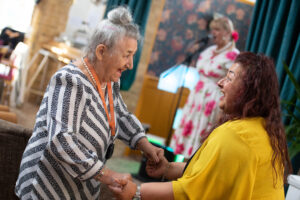 Resident Ottilie and her daughter Michelle take to the dance floor as residents, staff and guests enjoy a fun-filled day.