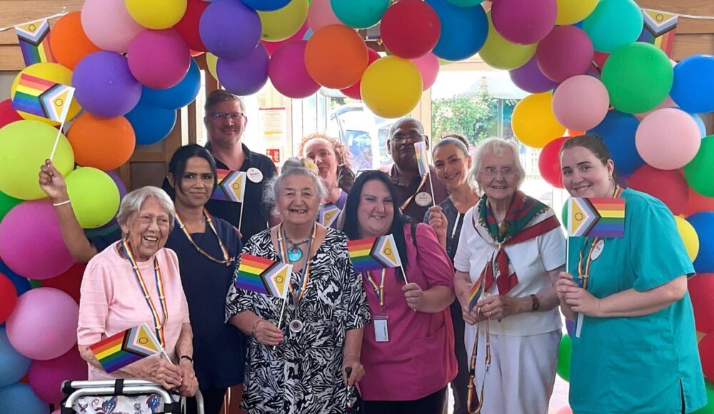 Residents and staff at RMBI Care Co. Home Prince Michael of Kent Court, in Watford celebrate Pride Month with a colourful balloon arch and flags.