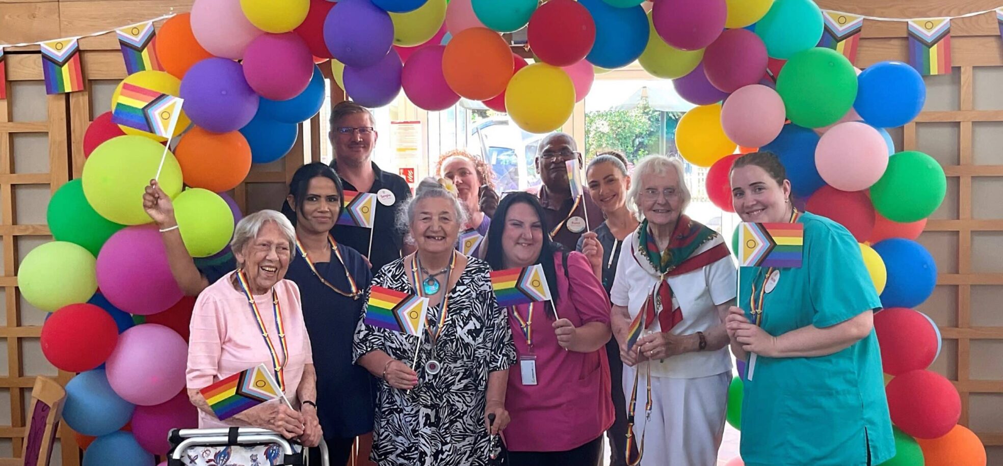 Residents and staff at RMBI Care Co. Home Prince Michael of Kent Court, in Watford celebrate Pride Month with a colourful balloon arch and flags.