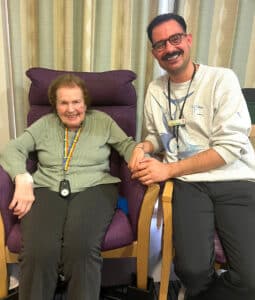 Resident and staff member at James Terry Court care home, in South Croydon.