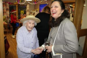 A care home resident greets the councillor.