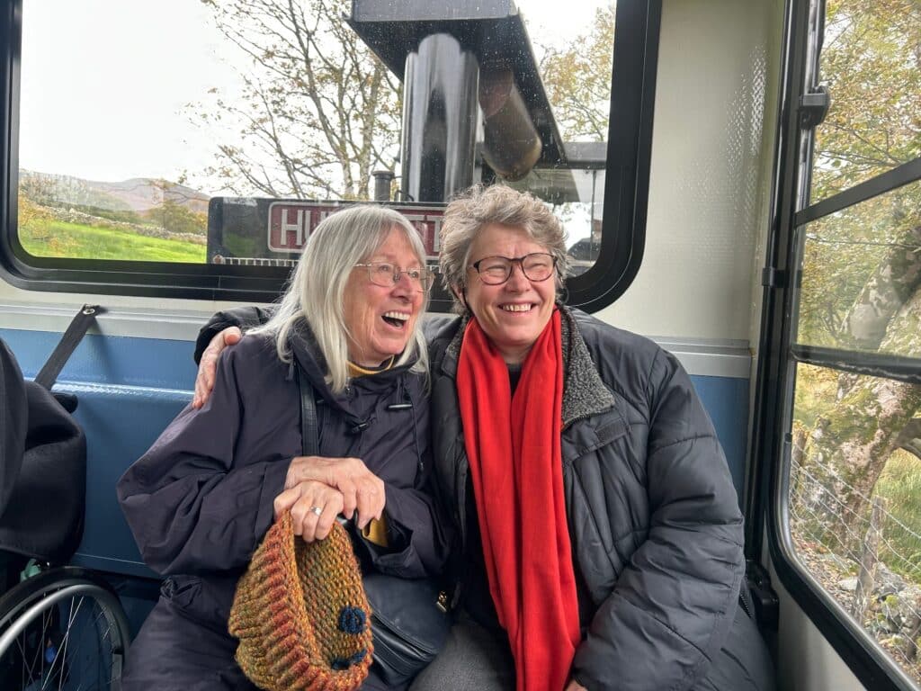 Queen Elizabeth Court resident Valerie and her daughter Zoe in full anticipation as they make their way up Mount Snowdon on the mountain railway.