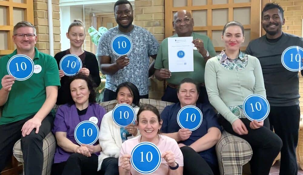 Staff at RMBI Care Co. Home Prince Michael of Kent Court, in Watford celebrate their top score on Carehome.co.uk.