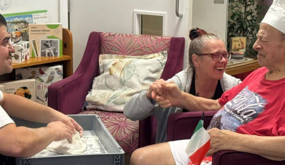 Resident Enzo chats and laughs with local chef, Giuseppe, pictured with staff member Ania.